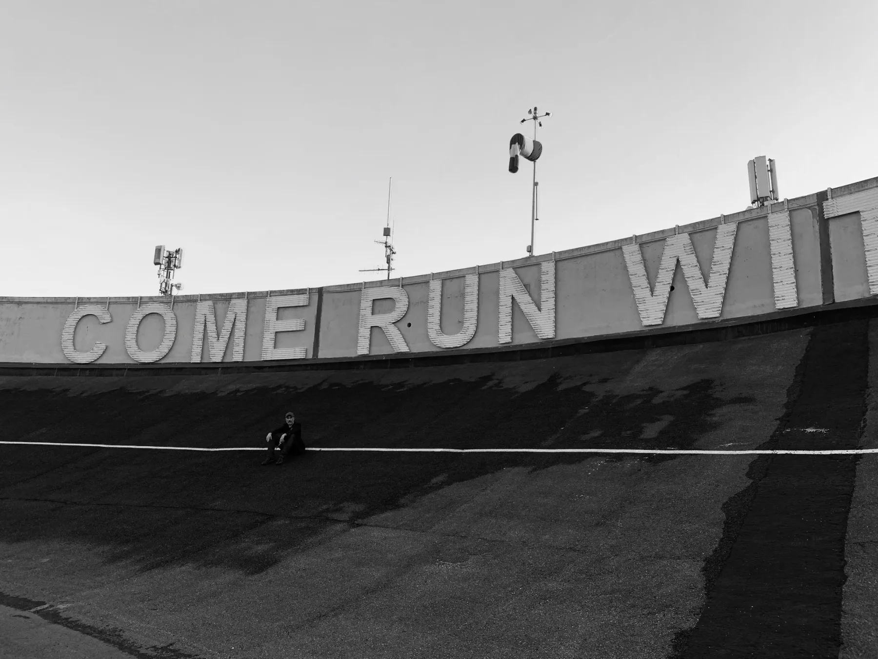 The author on the track. In the background Come Run With Me, 2024. Monica Bonvicini - Pista 500 Pinacoteca Agnelli / Lingotto (Torino)